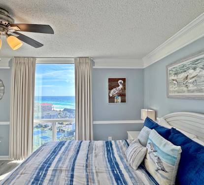 Wake up to stunning ocean views in your coastal-themed bedroom, where blue and white decor mirrors the sea outside your window.