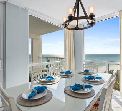 Enjoy memorable meals at your elegant dining table with breathtaking ocean views through floor-to-ceiling windows.