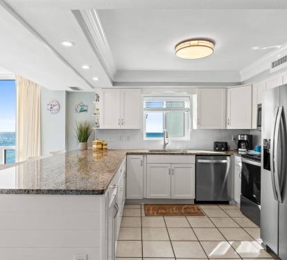Your stunning oceanfront kitchen features granite countertops, modern appliances, and breathtaking sea views while you cook.