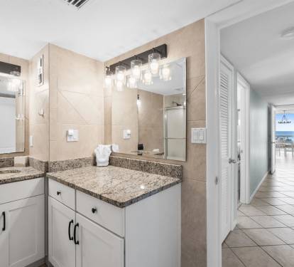 Your spacious bathroom features elegant granite countertops and modern fixtures, creating a luxurious space to refresh after beachside adventures.
