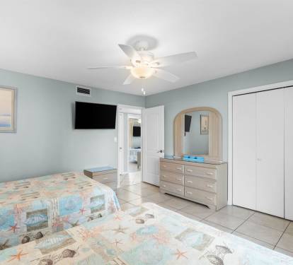 Unwind in your calming coastal bedroom with ocean-themed touches and all the essentials for a relaxing stay.