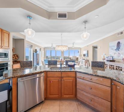 Your gourmet kitchen features granite countertops, stainless appliances, and stunning views perfect for cooking memorable meals.