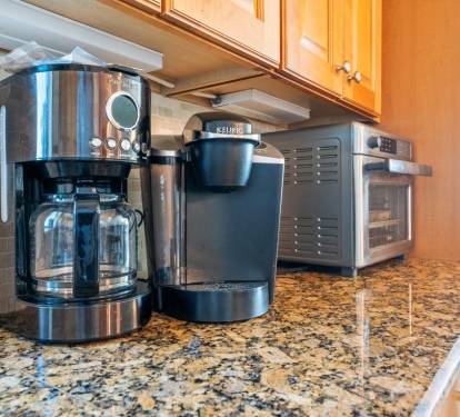 Start your mornings right with premium coffee makers and Keurig, plus a microwave for quick meals on your granite counters.