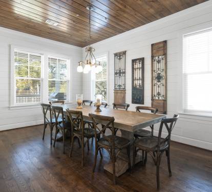 Gather around this beautiful farmhouse dining table where your group can share memorable meals beneath the stunning wood ceiling.