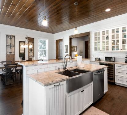 Your gourmet kitchen awaits with granite countertops, farmhouse sink, and rustic wood ceiling creating the perfect space for memorable meals.