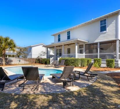 Stunning white coastal home with private pool and comfortable loungers awaits your perfect beach getaway retreat.