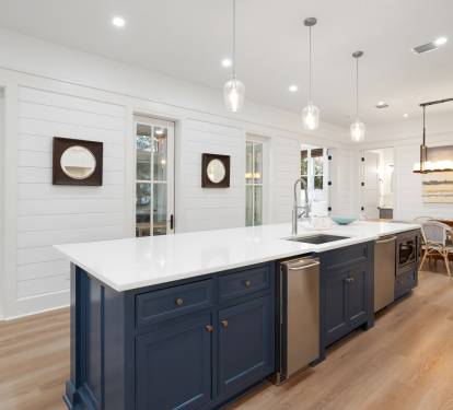 Your gourmet kitchen features pristine marble countertops and a spacious island perfect for preparing meals together.