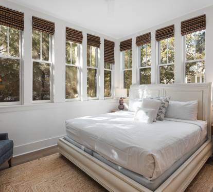 Wake up to natural light streaming through your private sanctuary, where crisp linens meet warm wood tones in perfect harmony.