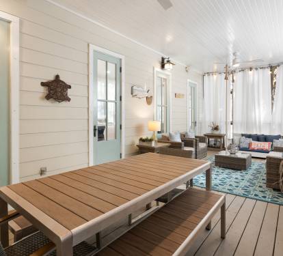 Relax in your private coastal screened porch with nautical charm, comfortable seating, and peaceful outdoor dining perfect for morning coffee or sunset meals.
