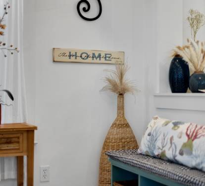 Sink into comfort surrounded by thoughtful touches—coastal decor and warm textures create your perfect home-away-from-home retreat.