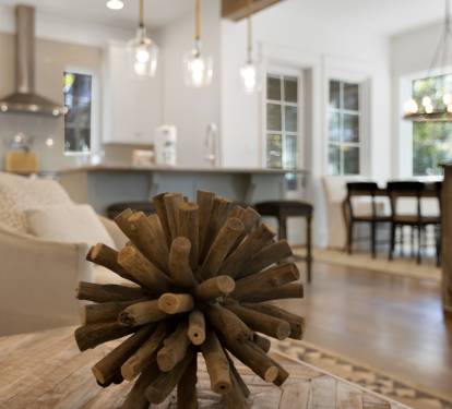 Your bright, open-concept living space seamlessly blends comfort and style with sleek pendant lighting, cozy seating, and a modern kitchen perfect for memorable stays.