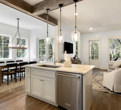 Your open-concept living space seamlessly blends modern comfort with rustic charm, featuring gleaming hardwood floors and soaring ceilings.