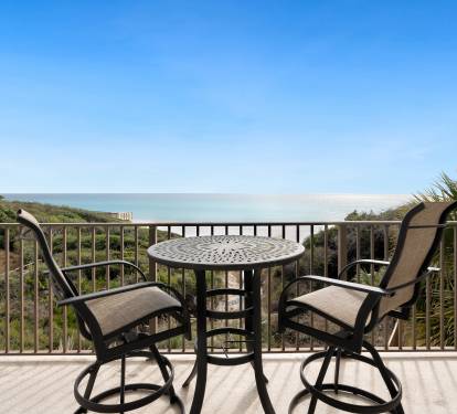 Beautiful gulf views stretch endlessly from this private balcony with comfortable seating for morning coffee or evening relaxation.