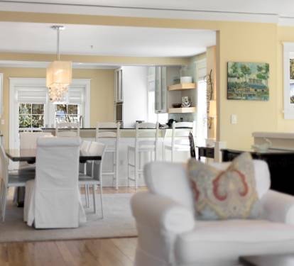 Your open-concept living flows seamlessly into a bright kitchen, where morning coffee tastes better at the elegant island.