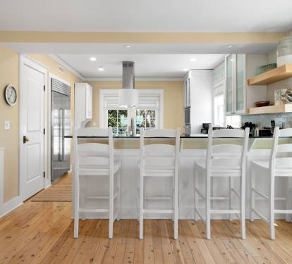 Gather around this gorgeous kitchen island where you'll create delicious meals together on gleaming counters with premium appliances.