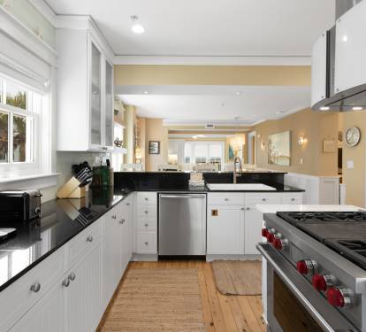 Your dream kitchen awaits with pristine white cabinets, sleek granite counters, and professional-grade stainless steel appliances ready for your culinary adventures.
