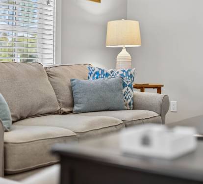 Sink into this plush sofa with your favorite book, surrounded by thoughtful touches that make this space feel like home.