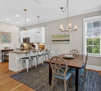 Gather around your elegant dining table for memorable meals, while the open kitchen invites culinary adventures with granite counters and modern appliances.