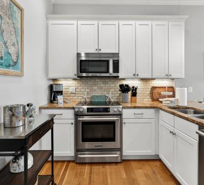Your fully equipped kitchen awaits with granite countertops, stainless appliances, and everything needed for memorable meals together.