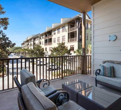 Your private balcony offers comfortable seating and peaceful views of the resort grounds.