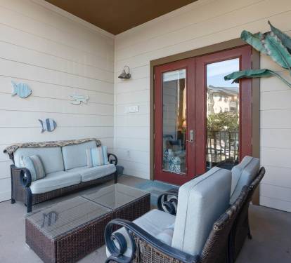 Your private covered patio offers comfortable seating where you can unwind with coastal breezes and peaceful moments outdoors.