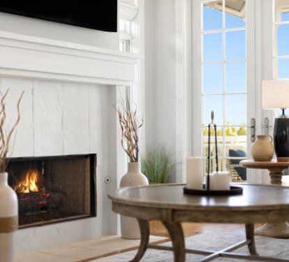 Relax by your crackling fireplace with French doors opening to scenic views, creating the perfect atmosphere for cozy evenings.