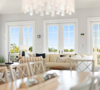 Sink into the plush sectional while natural light floods through French doors, creating your perfect spot to unwind with fireplace warmth nearby.