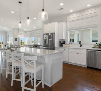 Your bright, spacious kitchen features marble countertops, stainless appliances, and island seating where you'll love gathering for morning coffee or meal prep.