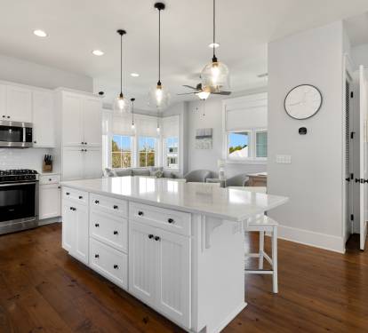 Your bright modern kitchen features gleaming countertops, stylish pendant lighting, and everything you need to create memorable meals together.