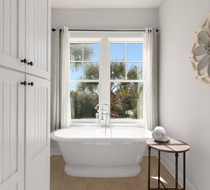 Soak in your elegant freestanding tub while gazing at swaying palms through the window—pure tropical tranquility awaits.