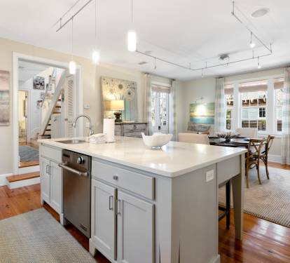 Your spacious kitchen features a gleaming marble island and modern appliances, perfect for preparing memorable meals during your stay.