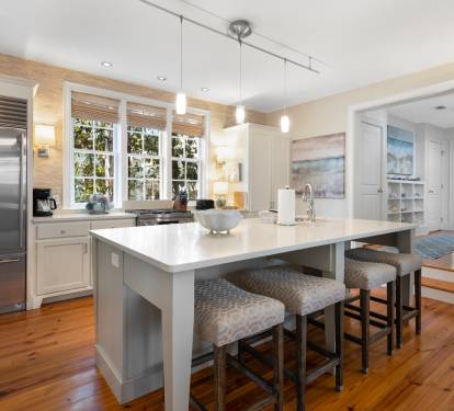 Step into your dream kitchen with gleaming countertops, stainless appliances, and a breakfast bar perfect for morning coffee or evening wine.
