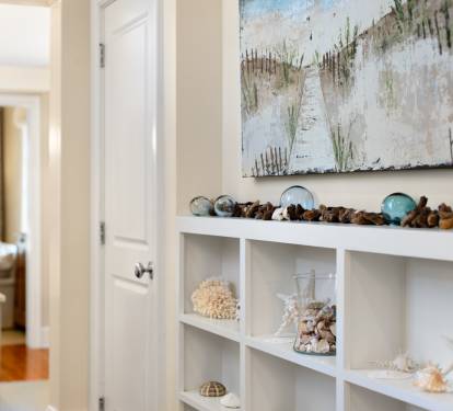 Admire coastal art and thoughtful touches while exploring your beautifully appointed space, where every detail invites relaxation.