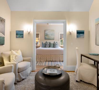 Unwind in your coastal-themed living space, where ocean-inspired art and plush seating create the perfect retreat after beachside adventures.