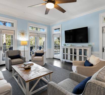 Unwind in your bright, airy living room with French doors opening to private balconies and comfortable seating for memorable moments.