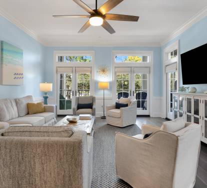 Settle into this bright, airy living room where coastal charm meets comfort. Plush seating and calming blues create your perfect relaxation retreat.