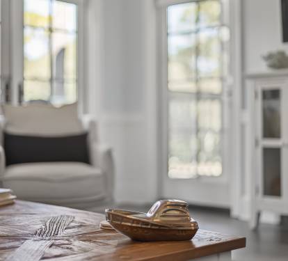Unwind in your bright, airy living space where natural light streams through elegant windows, creating the perfect atmosphere for relaxation.