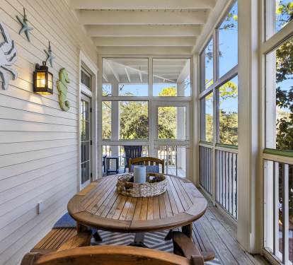 Your private screened porch offers peaceful dining with treetop views—perfect for morning coffee or evening meals surrounded by nature.