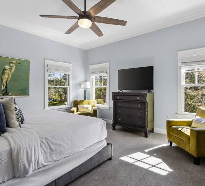 Sink into plush bedding while natural light streams through your windows, creating the perfect retreat for restful nights and peaceful mornings.