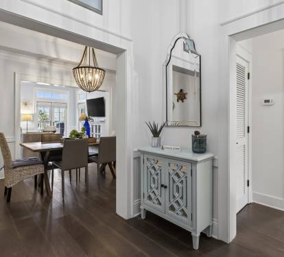 Elegant foyer welcomes you with coastal charm and refined touches, leading to beautifully appointed dining and living spaces.