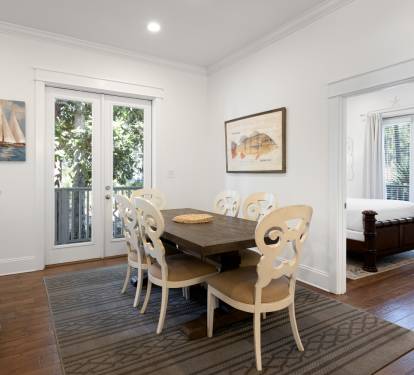 Gather around this elegant dining table where coastal charm meets comfort, perfect for sharing meals and making memories.