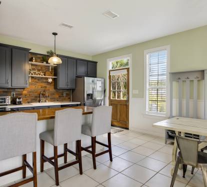 Your fully equipped kitchen awaits with modern appliances, granite counters, and cozy breakfast bar seating for memorable meals.