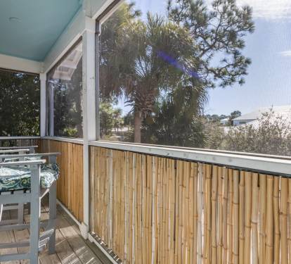 Step onto your private balcony and breathe in the tropical air. Bamboo railings frame leafy views while comfortable seating awaits your morning coffee moments.