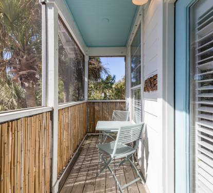 Step out onto your private screened balcony and breathe in the tropical breeze while relaxing in your peaceful outdoor retreat.