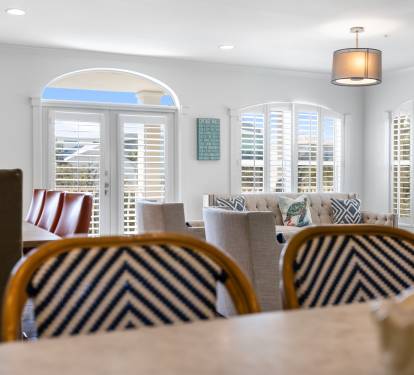 Relax in your beautifully appointed living space where comfortable seating and coastal-inspired decor create the perfect retreat.