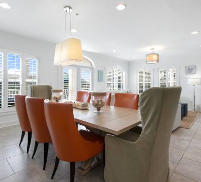 Gather around your stylish dining table where warm leather chairs invite memorable meals and conversation.