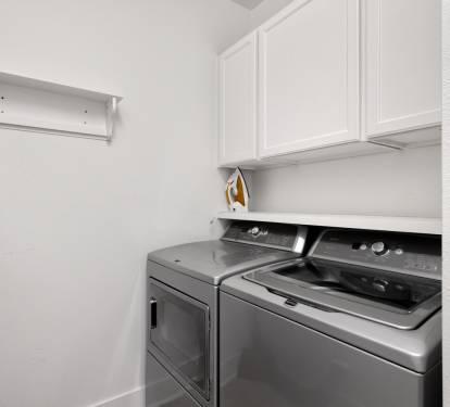 Your dedicated laundry space features modern appliances and built-in storage, making it easy to keep your belongings fresh during your stay.