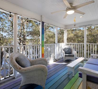 Relax in your private screened porch with colorful seating and peaceful treetop views—perfect for morning coffee or evening conversations.