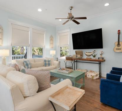 Sink into plush seating while coastal breezes flow through your bright living space, complete with entertainment and charming nautical touches.