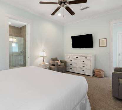 Your spacious master bedroom features a cozy seating area and private ensuite bathroom for ultimate comfort and relaxation.
